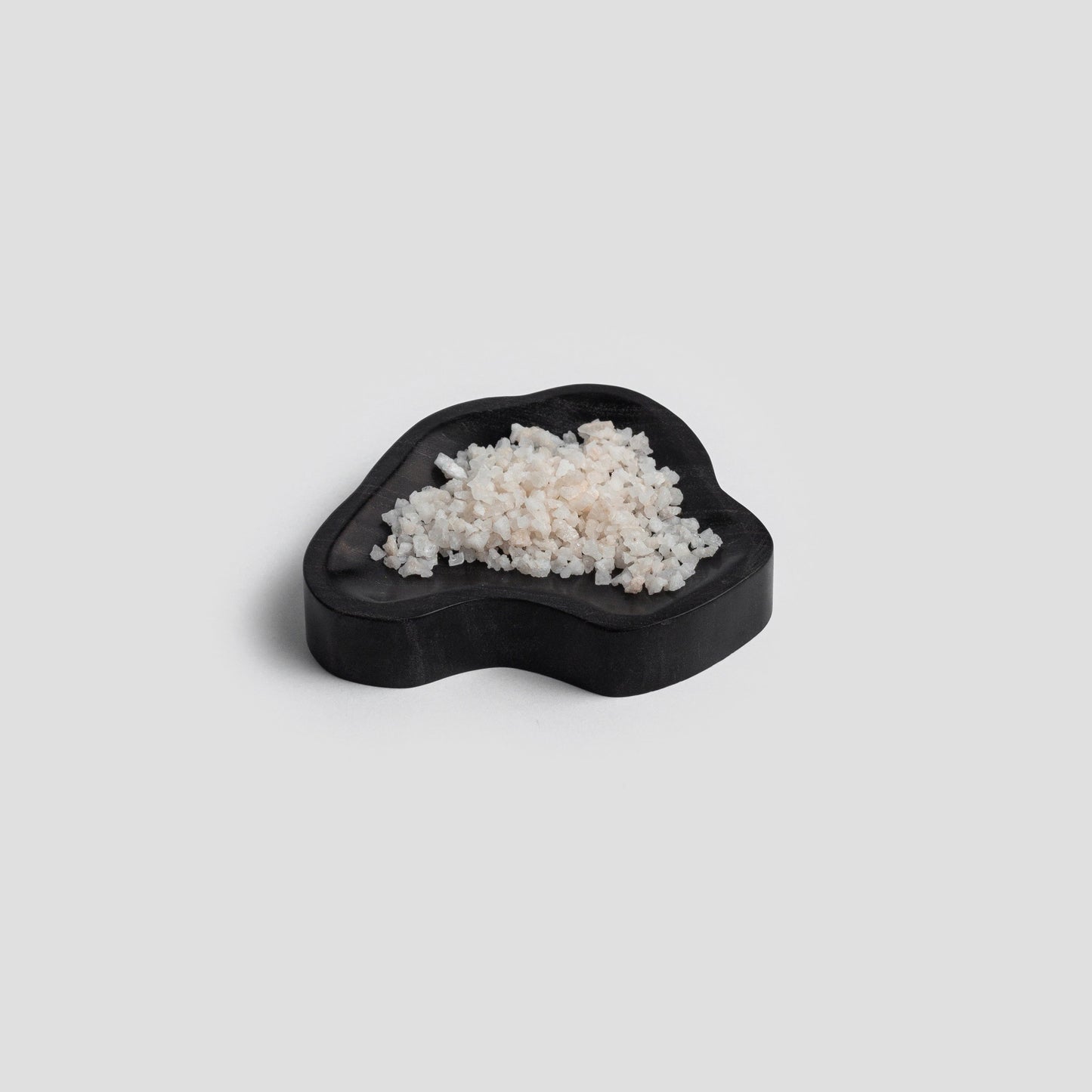 Organic 4" gemstone dish black onyx catchall. This sweet little dish adds a pop of the Andes to a small space.