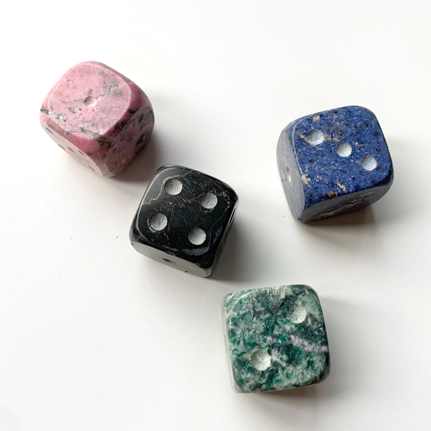 Giant gemstone Dice - set of 4. Hand-carved from Pink Rhodonite, Turquoise Rhodonite, Black Onyx and Blue Sodalite dice.