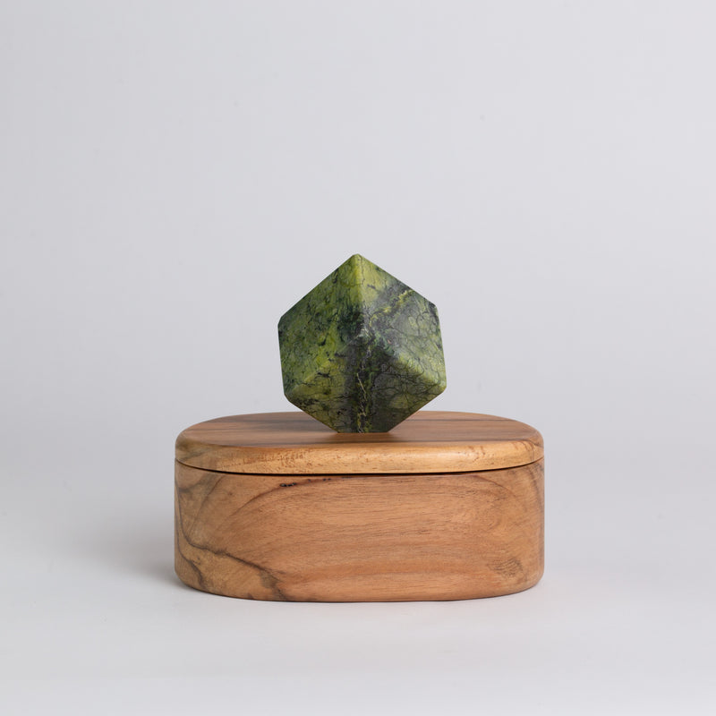 Oval serpentine green gemstone jewel box showcasing its rich natural patterns on a white background.