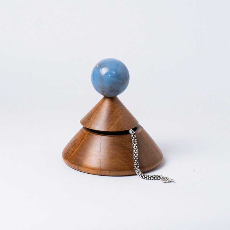 Cool Cone jewel box carved from solid blue angelite stone showcasing its unique geometric design on a white background.