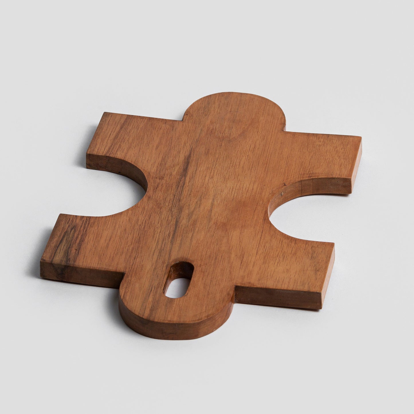 Puzzle piece wooden cutting board - 11
Handcrafted from natural wood, it's both a conversation starter and a versatile serving piece.