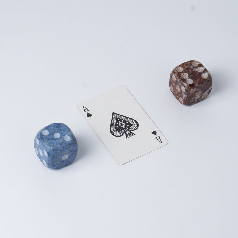 Set of 2 decorative natural stone dice in Red Jasper and Dumortierite on a white background.