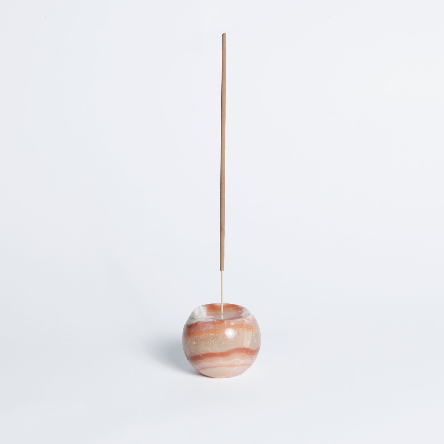 Gemstone sphere incense holder - Onyx Crema. A flat base and slightly curved lip allow the moon shaped sphere to sit on any table top and invite focus and creative grounding.