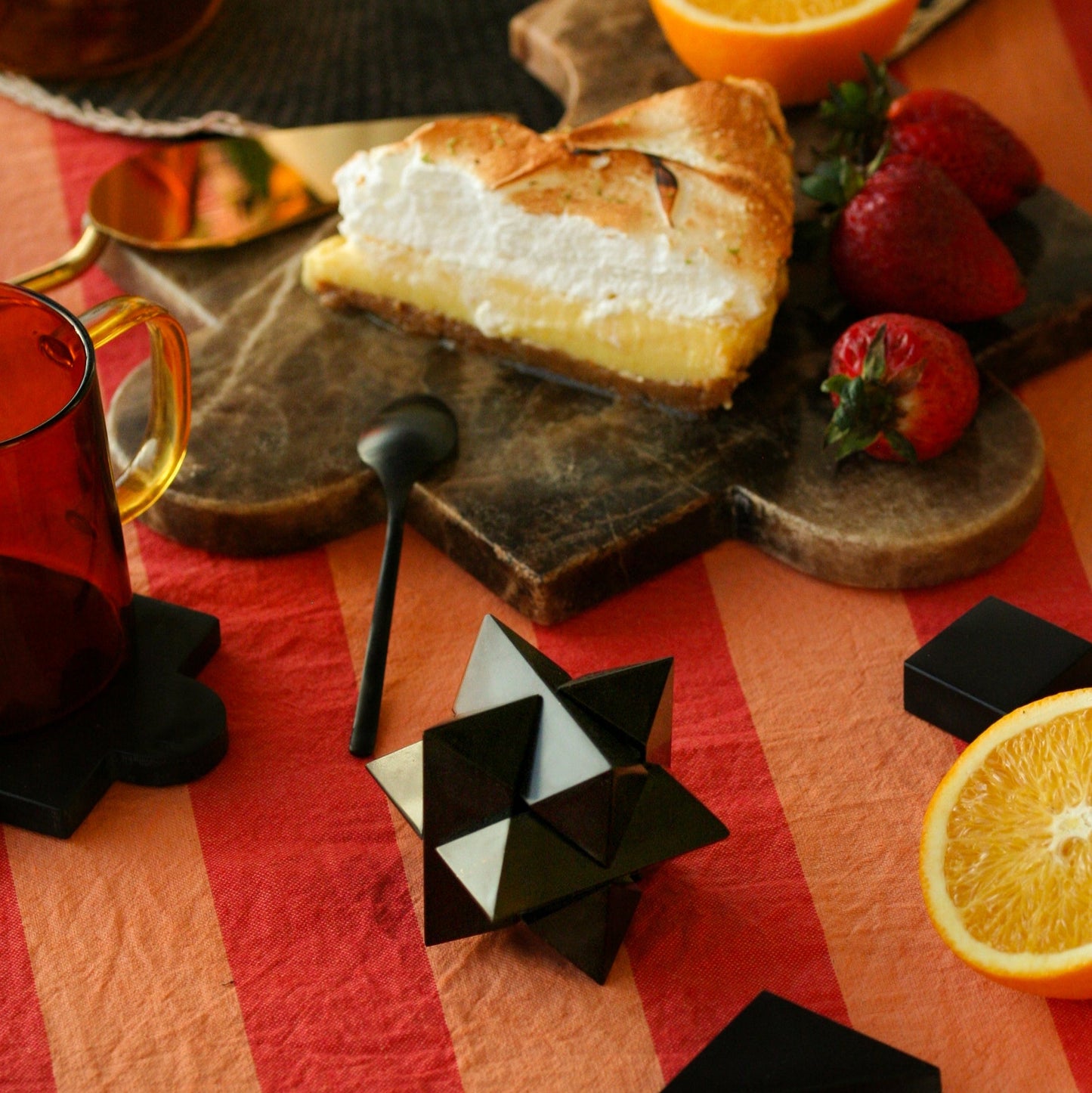 Black onyx decorative puzzle bringing depth and a sense of Andean materiality to an interior layout.
