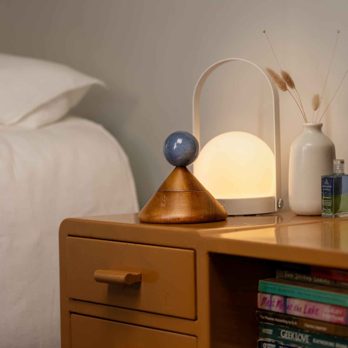 Cool Cone Jewel box - Angelite. The sphere-shaped gemstone handle is a geometric element that makes the moment of opening it up feel extra special.
