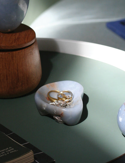 Collection of natural stone containers including the blue angelite catch-all in a quiet luxury home decor setting.