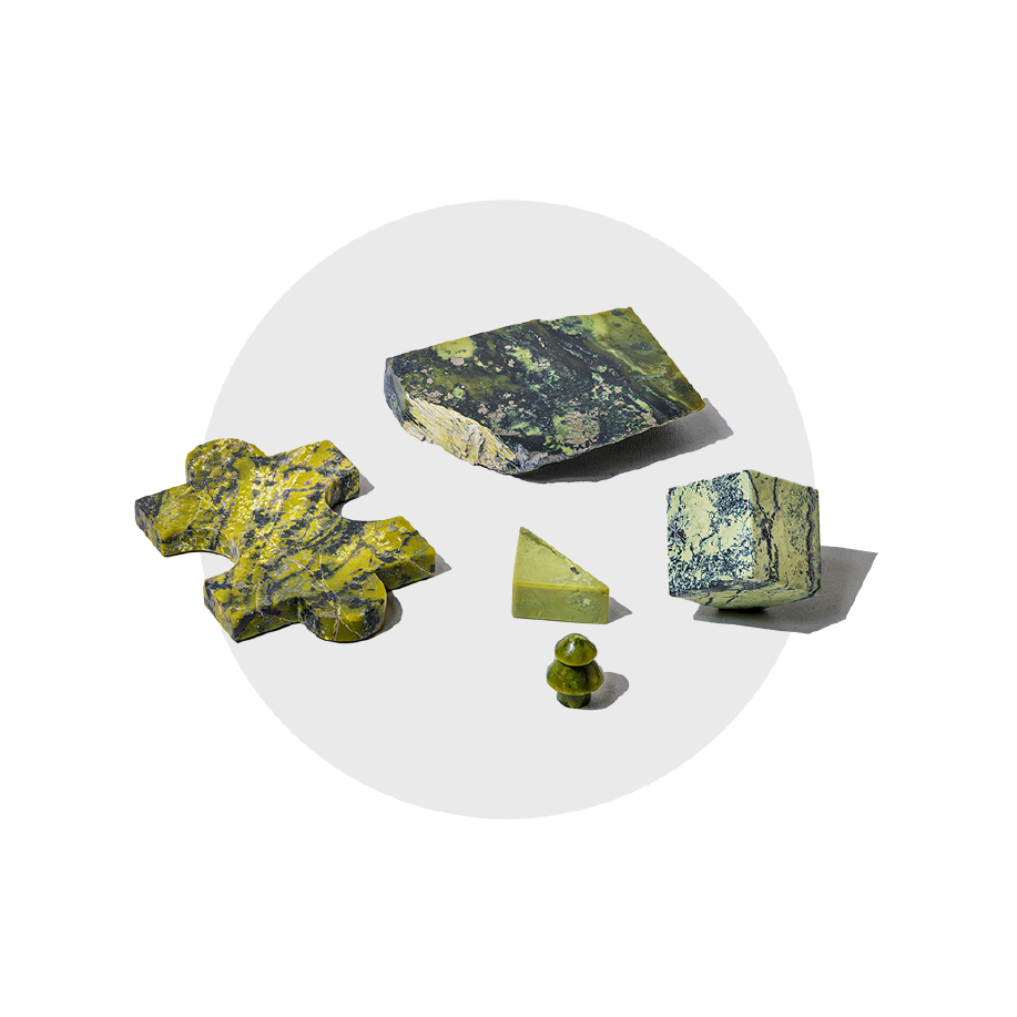 Semi-precious gemstone puzzle pieces, handcarved from green serpentine