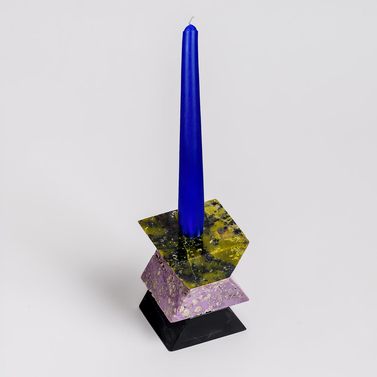 Triangle-shaped gemstone puzzle that transforms into a stunning 3-piece candelabra.