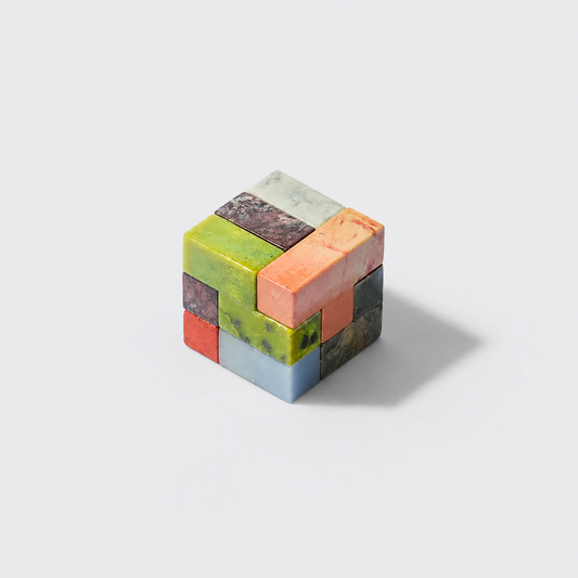 Standard-sized gemstone Soma cube puzzle displaying natural mineral textures on a white background.
