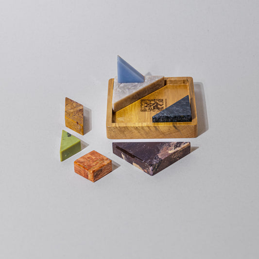 Tangram Gemstone Puzzle is a meditative dream to solve, as you weigh the 7 pieces of brightly colored gemstones in your hands to solve.