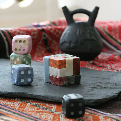 Decorative gemstone cube serving as an understated luxury object in a contemporary room.
