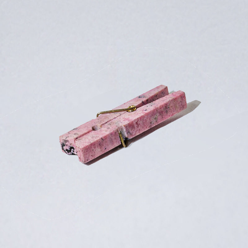 Rhodonite pink decorative gemstone laundry clip showcasing natural warm hues on a white background.