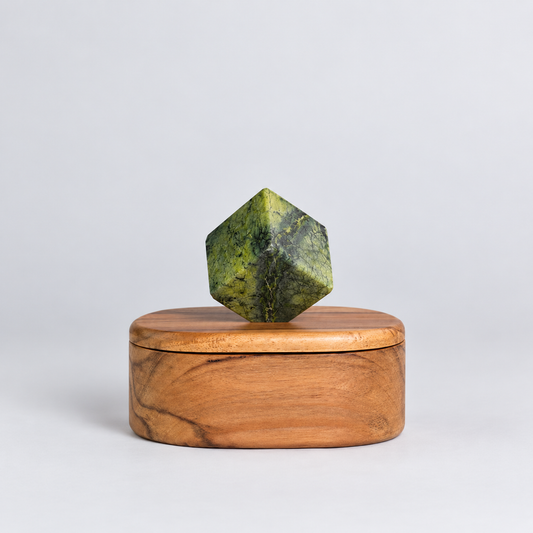 Oval serpentine green gemstone jewel box showcasing its rich natural patterns on a white background.