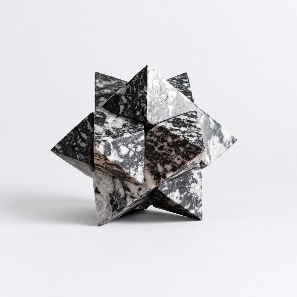 Geometric zebra jasper star, made of precisely proportioned interlocking pieces.