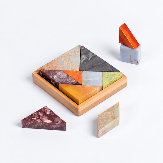 Multi-stone Tangram gemstone puzzle displaying intricate natural tones on a white background.