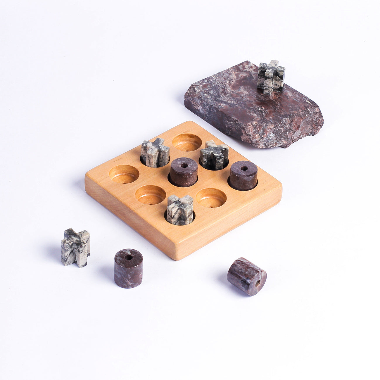 Handcrafted gemstone Tic Tac Toe puzzle game showcasing natural mineral textures on a white background.