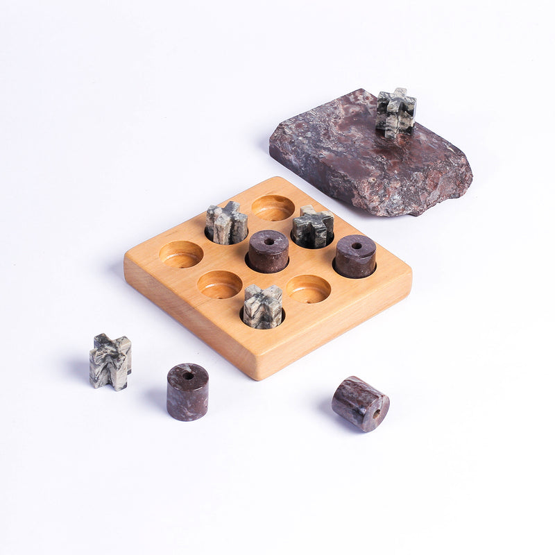 Handcrafted gemstone Tic Tac Toe puzzle game showcasing natural mineral textures on a white background.