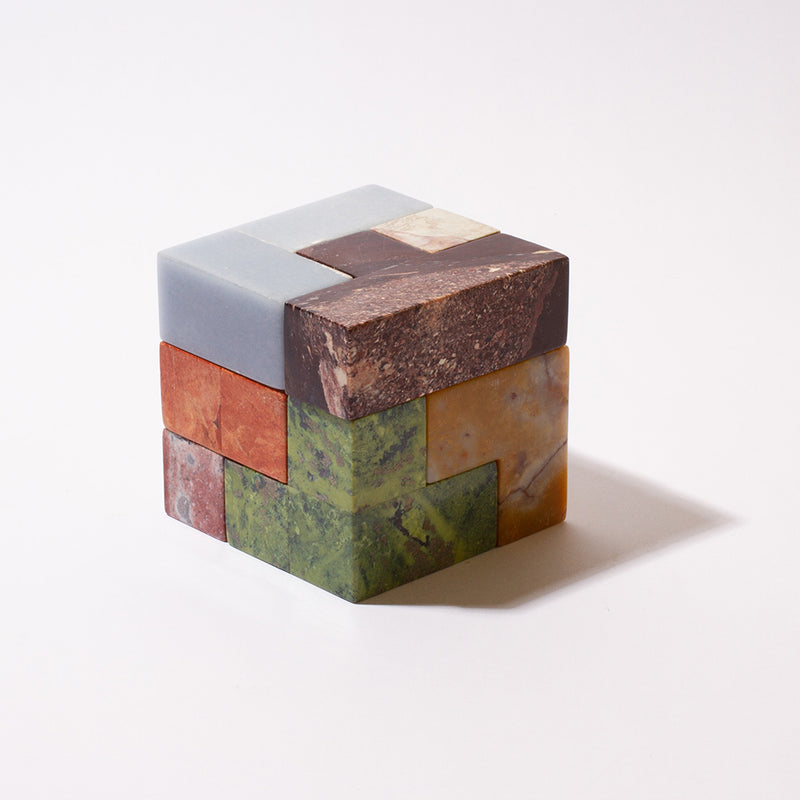 XL gemstone Soma cube puzzle showcasing its substantial size and solid stone construction on a white background.