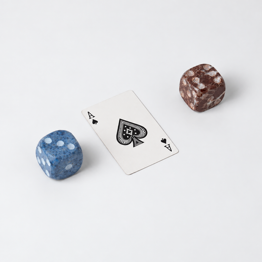 Set of 2 decorative natural stone dice in Red Jasper and Dumortierite on a white background.