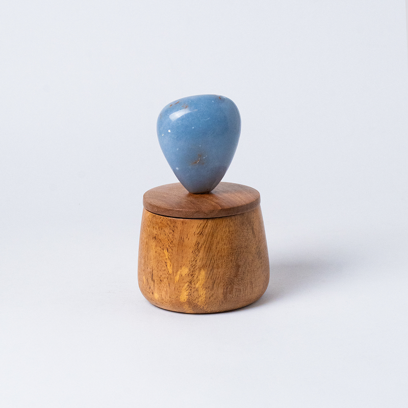 Cloud round jewel box carved from natural blue angelite stone displaying its smooth organic curves on a white background.