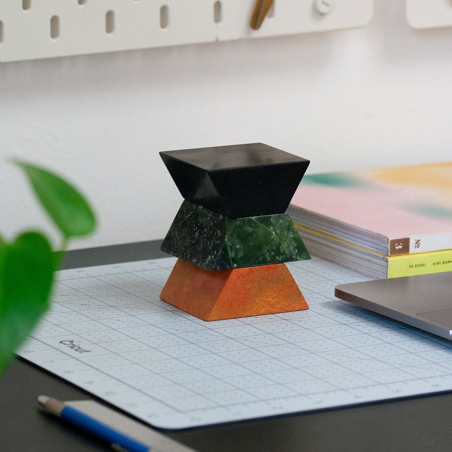 Triangle sculptural puzzle carved from gemstones and semi-precious stone