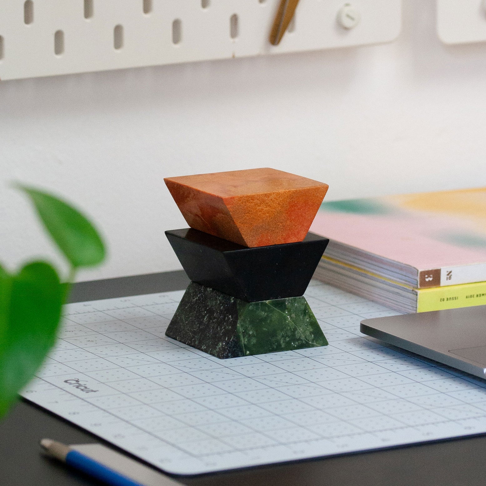 Triangle sculptural puzzle carved from gemstones and semi-precious stone