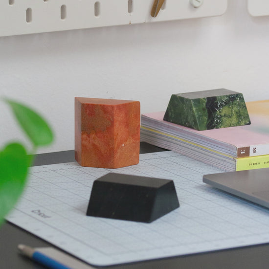 Stop motion video of the triangle sculptural puzzle carved from gemstones and semi-precious stones - a delightful desktop object